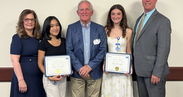 From left: Dr. Linda Valentino, Calvary Hospital Chief Nursing Officer; Flynn Fellow Althea Leigh Castro; Frederick C. Flynn Jr., Founder and President of the Flynn Foundation; Flynn Fellow Olivia Nealis; and Calvary Hospital President Michael Fosina at the July 31 graduation ceremony at Calvary Hospital.